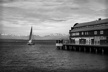 Street Photography Image of Seattle Washington Waterfront and a sailboat
